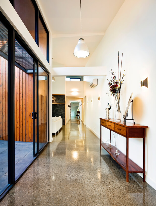 Red Hill Residence’s marbled lobby with white walls
