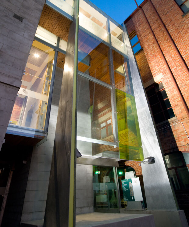 Fitzroy Town Hall - Timber wall and ceiling cladding, glass panels, and lightly coloured floor tiles